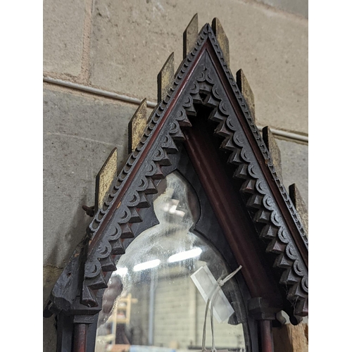 157 - A Victorian painted Gothic style arched wall mirror, height 84cm