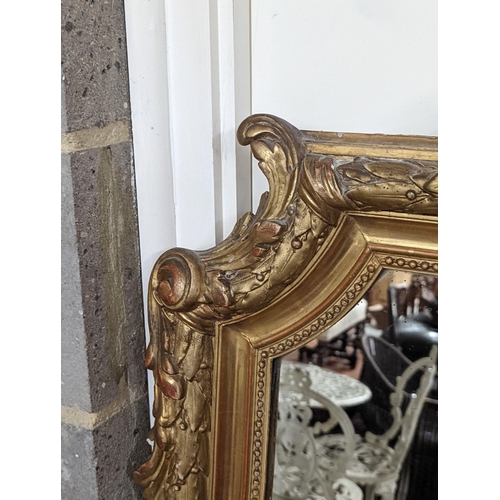 159 - A 19th century French carved giltwood overmantel mirror, width 100cm, height 150cm