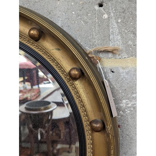 161 - A Regency style circular gilt framed wall mirror, diameter 59cm