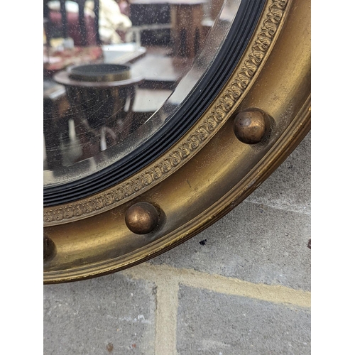 161 - A Regency style circular gilt framed wall mirror, diameter 59cm