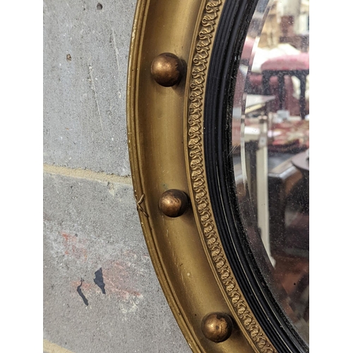 161 - A Regency style circular gilt framed wall mirror, diameter 59cm