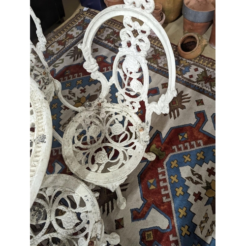 165 - A Victorian style painted aluminium circular garden table, diameter 72cm, together with four chairs... 