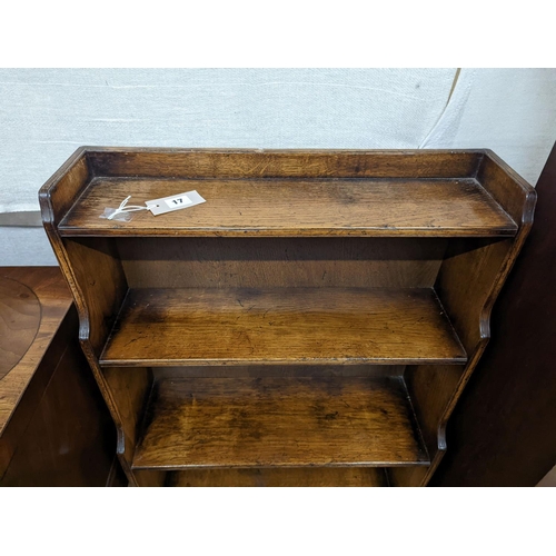 17 - A reproduction 18th century style oak graduated open bookcase, width 60cm, depth 27cm, height 104cm... 