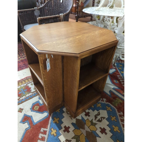 172 - A 1930's Heals style octagonal golden oak book table, width 60cm, height 58cm