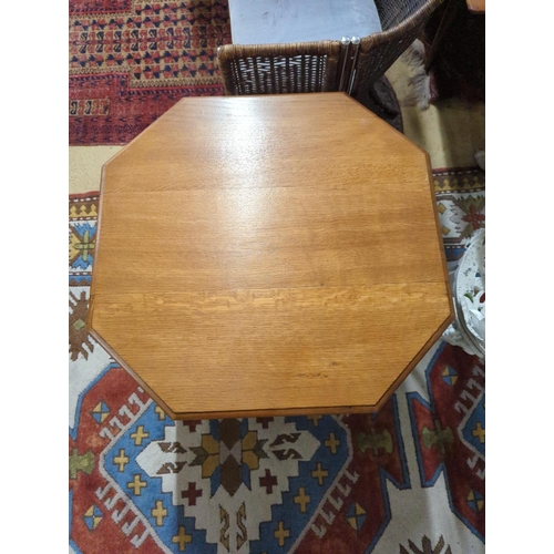 172 - A 1930's Heals style octagonal golden oak book table, width 60cm, height 58cm