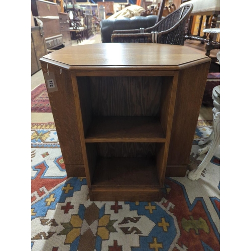 172 - A 1930's Heals style octagonal golden oak book table, width 60cm, height 58cm