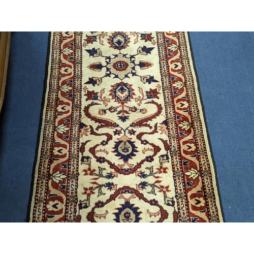 179 - An Uzbek style rug, 320 x 84cm