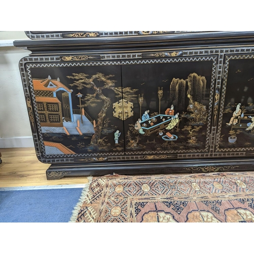 184 - A Chinese lacquer decorated cabinet. W-200cm, D-45cm, H-201cm.