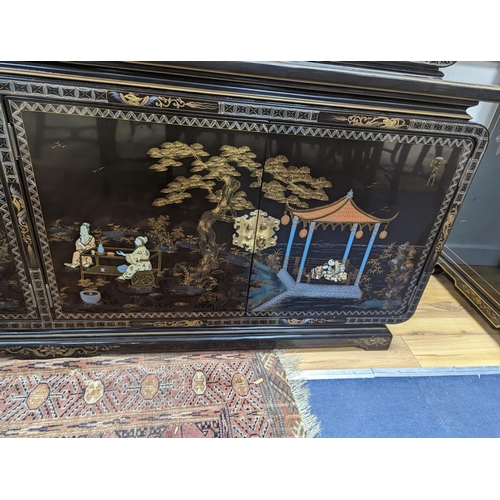 184 - A Chinese lacquer decorated cabinet. W-200cm, D-45cm, H-201cm.