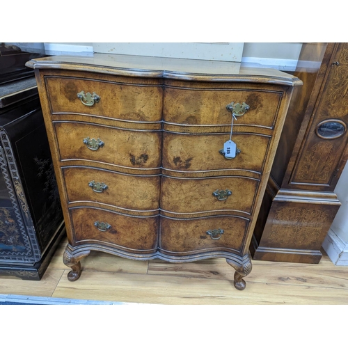 185 - A 1920's Queen Anne revival banded walnut shaped front chest, width 76cm, depth 46cm, height 85cm... 