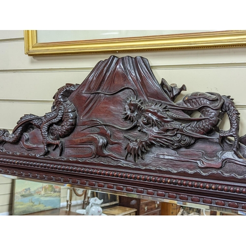 193 - A Japanese carved hardwood dragon overmantel mirror, width 112cm, height 180cm