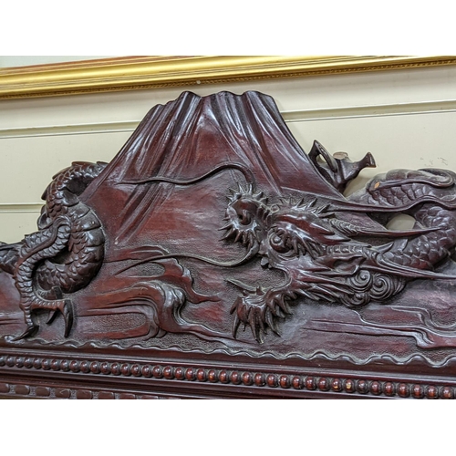 193 - A Japanese carved hardwood dragon overmantel mirror, width 112cm, height 180cm