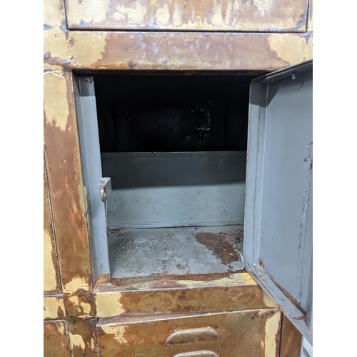 20 - An industrial style metal locker unit. W-91cm, D-49cm, H-198cm.