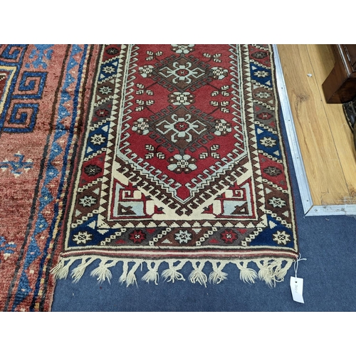 201 - A Caucasian design red ground runner, 300 x 78cm