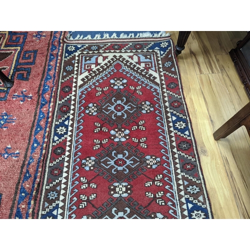 201 - A Caucasian design red ground runner, 300 x 78cm