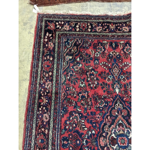 21 - A Tabriz style red ground carpet, 290 x 190cm