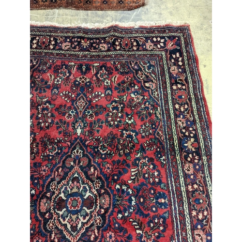 21 - A Tabriz style red ground carpet, 290 x 190cm