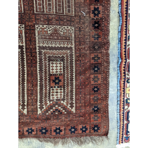 22 - An Afghan red ground prayer rug, 166 x 120cm