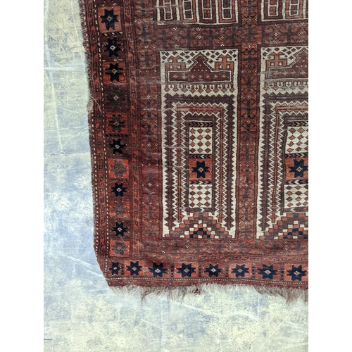 22 - An Afghan red ground prayer rug, 166 x 120cm