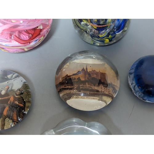 255 - Nine various glass paperweights