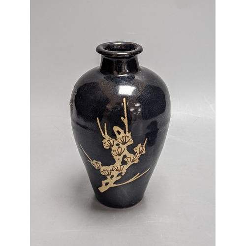 260 - A Chinese oil spot glazed cup with integral stand and a black glazed  resist pottery vase, 18cm... 