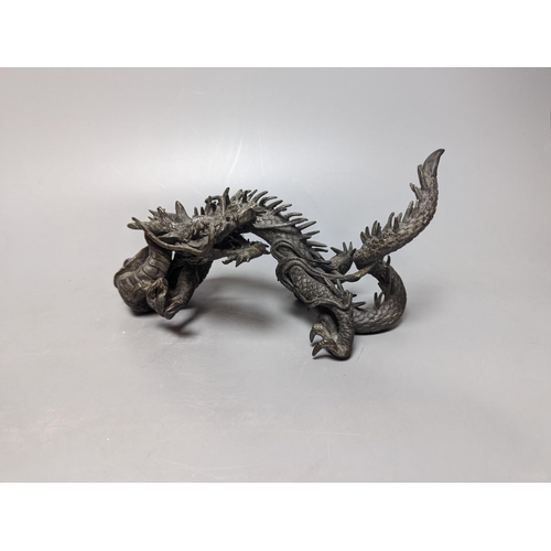 269 - A pair of early 20th century Japanese bronze figures of dragons 22cm