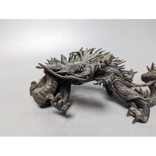 269 - A pair of early 20th century Japanese bronze figures of dragons 22cm