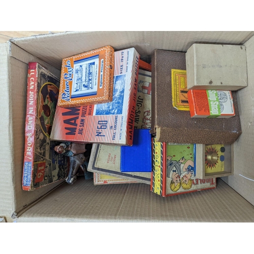 283 - Two boxes containing games and puzzles, late 19th to mid 20th century