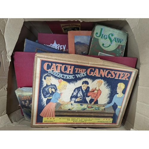 283 - Two boxes containing games and puzzles, late 19th to mid 20th century