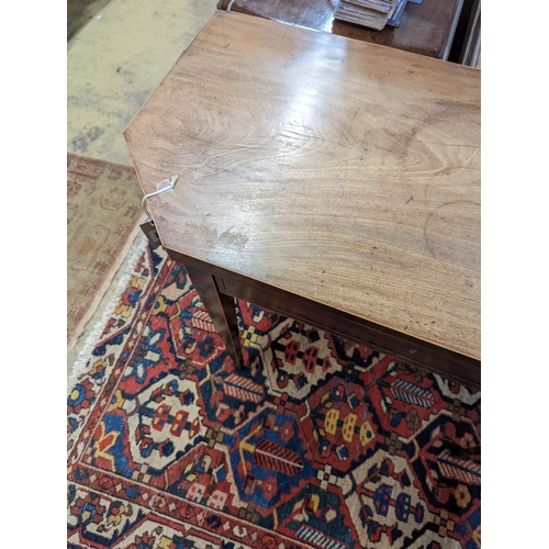 30 - A George III faded mahogany folding tea table, width 97cm, depth 47cm, height 75cm