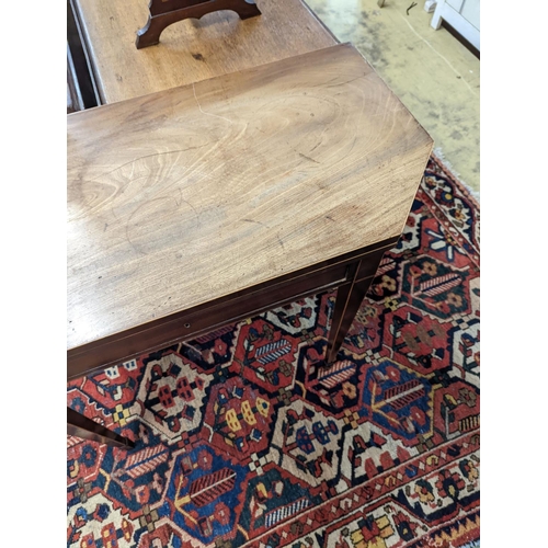 30 - A George III faded mahogany folding tea table, width 97cm, depth 47cm, height 75cm