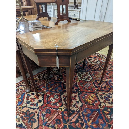 30 - A George III faded mahogany folding tea table, width 97cm, depth 47cm, height 75cm