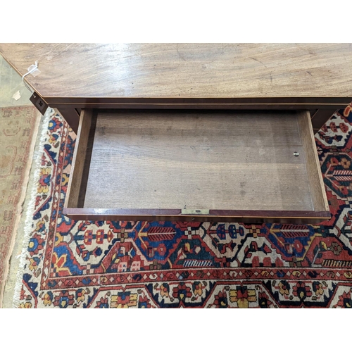 30 - A George III faded mahogany folding tea table, width 97cm, depth 47cm, height 75cm