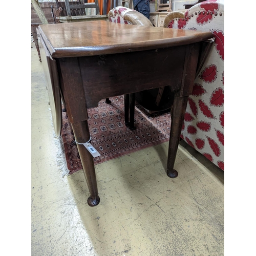 32 - A mid 18th century oak gateleg table. W-132cm, D-156cm, H-71cm.