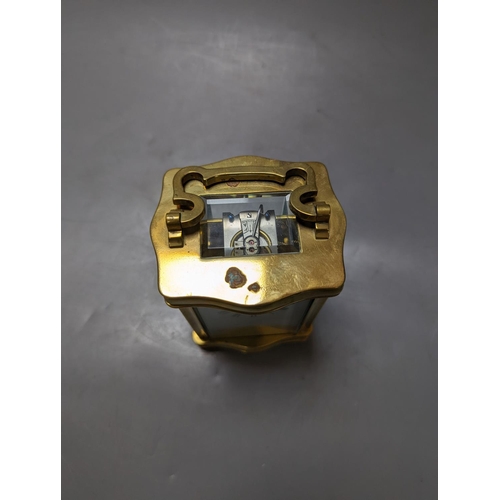 325 - A brass cased carriage timepiece