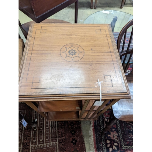 33 - An Edwardian inlaid satinwood revolving bookcase, width 48cm, depth 47cm, height 85cm