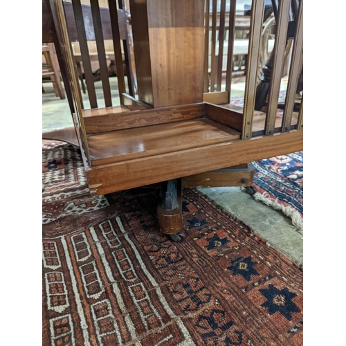 33 - An Edwardian inlaid satinwood revolving bookcase, width 48cm, depth 47cm, height 85cm