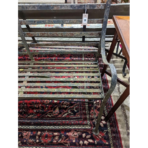 36 - A 19th century painted wrought iron garden bench, length 122cm, depth 44cm, height 92cm