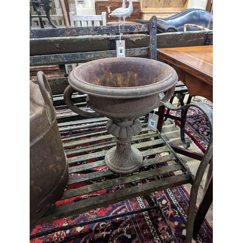 37 - A pair of circular cast iron campana urns, diameter 29cm, height 35cm together with an iron milk chu... 