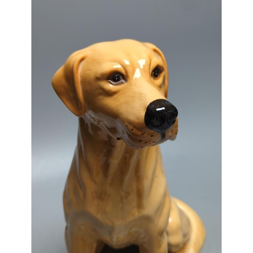 391 - A large Royal Doulton figure of a seated Labrador (No. 2314), height 34cm, a small Beswick Airedale ... 