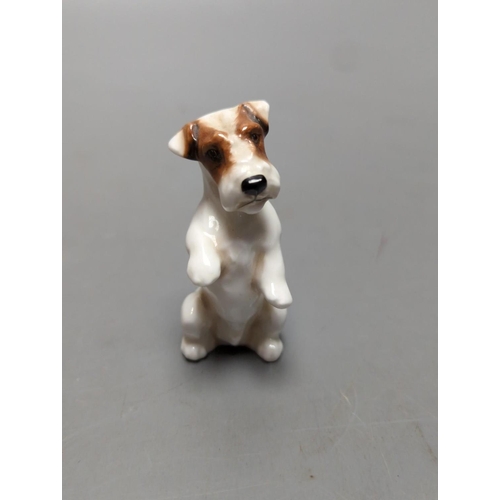 391 - A large Royal Doulton figure of a seated Labrador (No. 2314), height 34cm, a small Beswick Airedale ... 