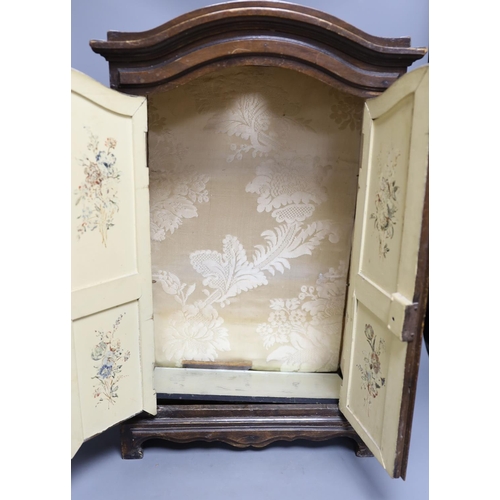 394 - A miniature beech armoire, 57 cms high.