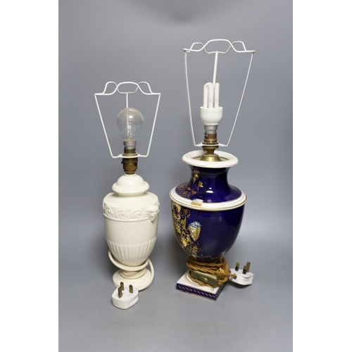 396 - A Derby gilt and floral decorated lamp and Wedgwood lamp, tallest 30 cms high.