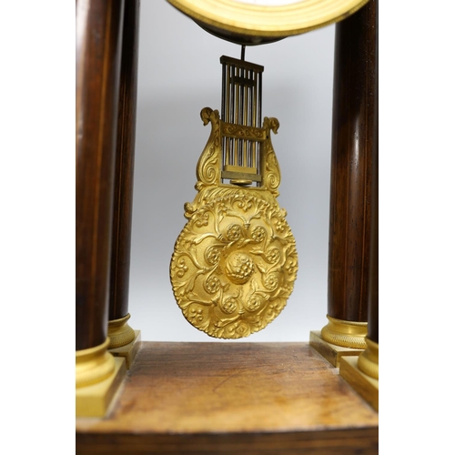 404 - A French rosewood portico clock, with pendulum, no key, 44 cms high.