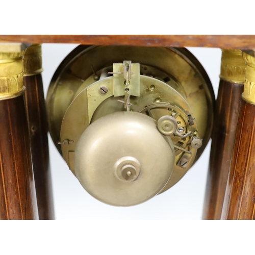 404 - A French rosewood portico clock, with pendulum, no key, 44 cms high.