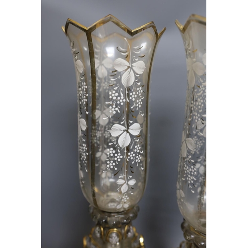 406 - A pair of white-enamelled glass lustre storm lamps, 55cms high.