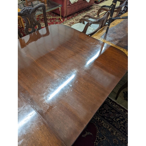 41 - A reproduction George III style rectangular  mahogany extending dining table, 241cm extended, one sp... 