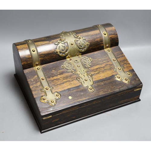 412 - A coromandel stationery box with brass mounts, 32 cms wide.