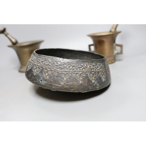 422 - Two pestles and mortars and a Chinese gong with beater, gong 21 cms wide.