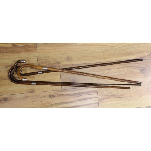 427 - Four silver mounted walking canes, longest 85 cms.